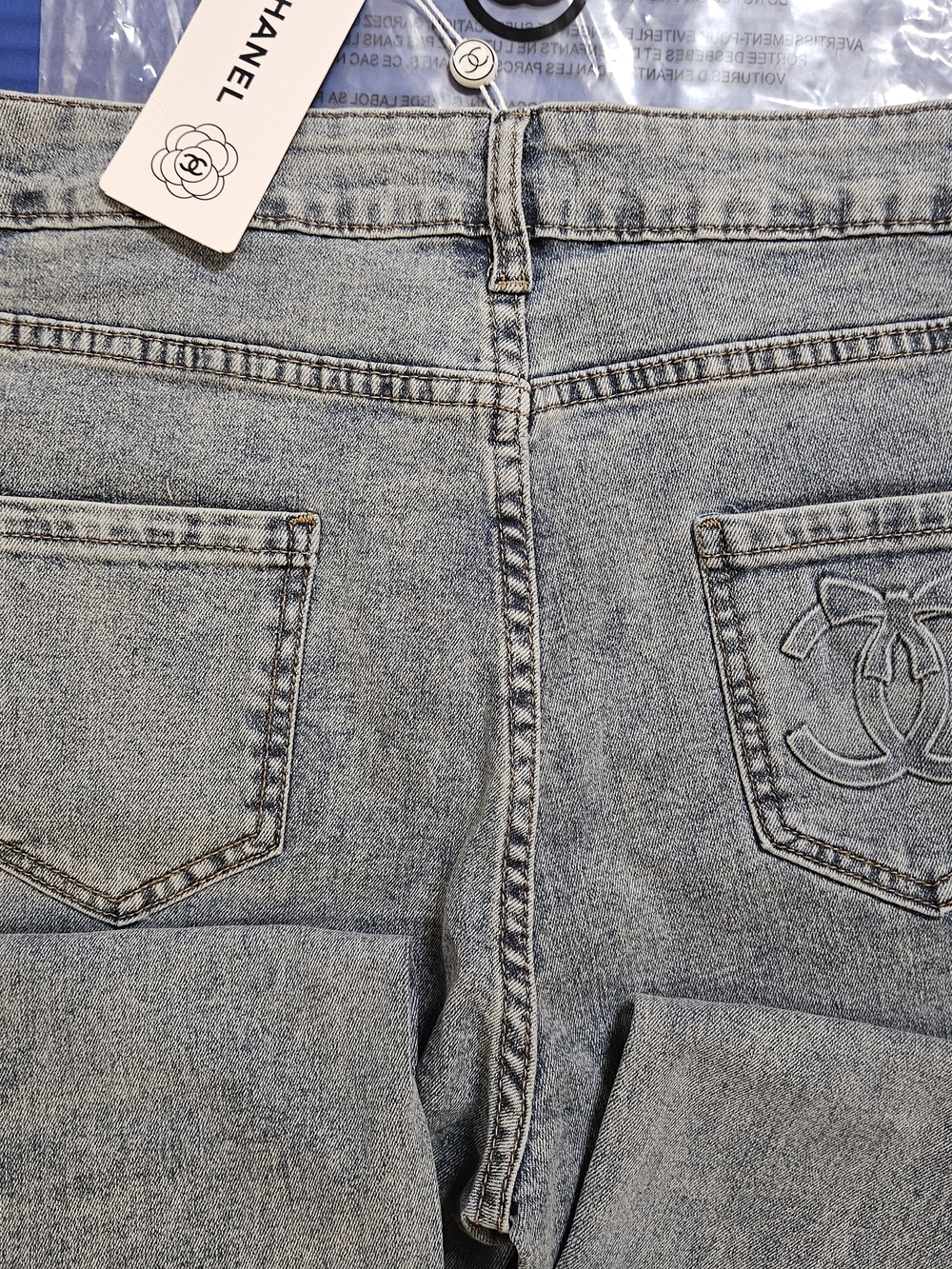 Light Blue High-Rise Women’s Jeans with Gold Button Accent - Picture 5 of 9